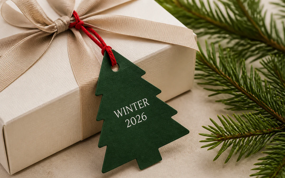 Christmas tree shaped swing tag tied to a gift box