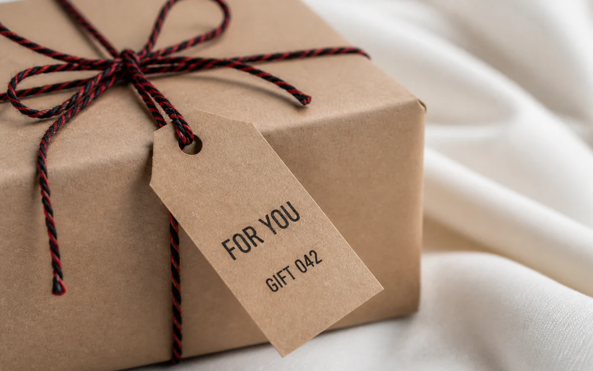 Kraft swing tag tied to a wrapped gift box