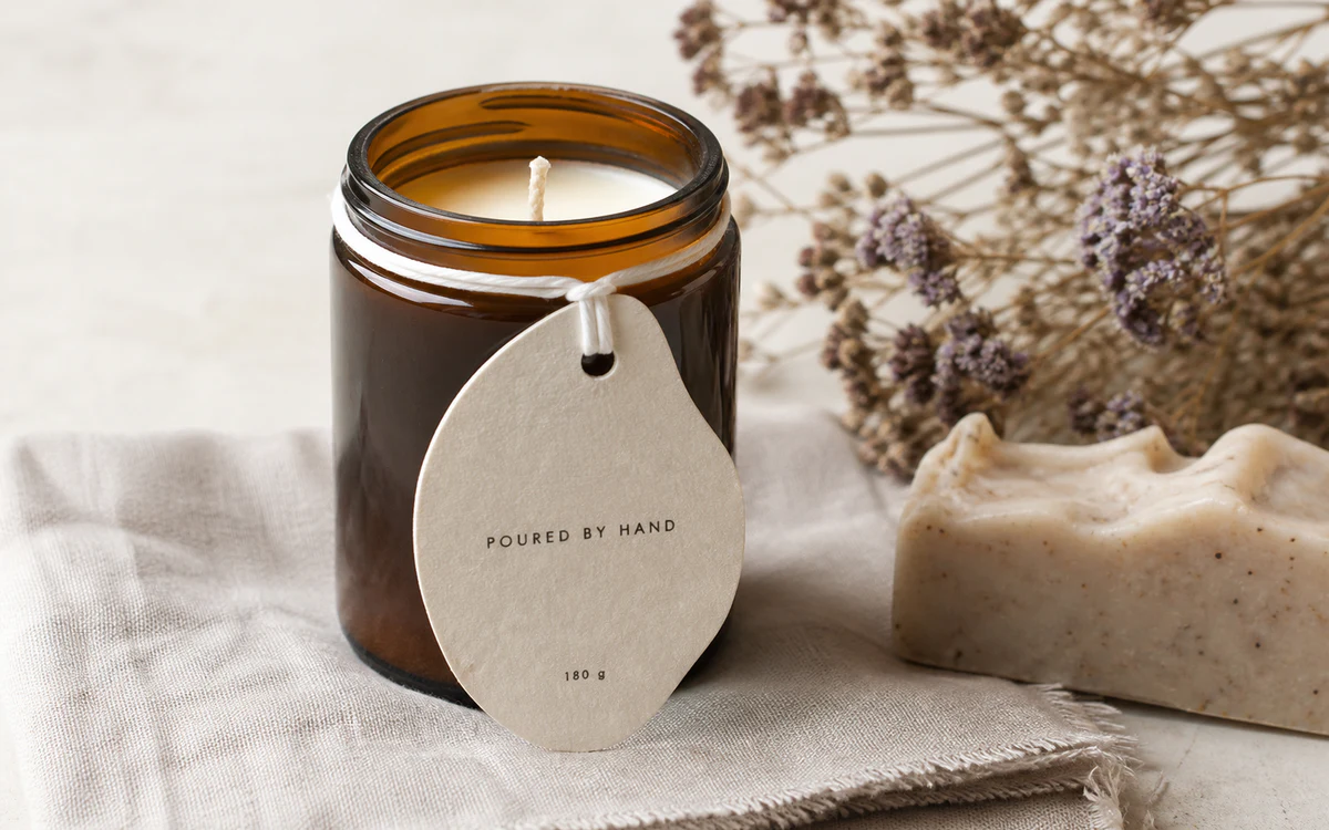 Organic shaped swing tag on a hand-poured candle