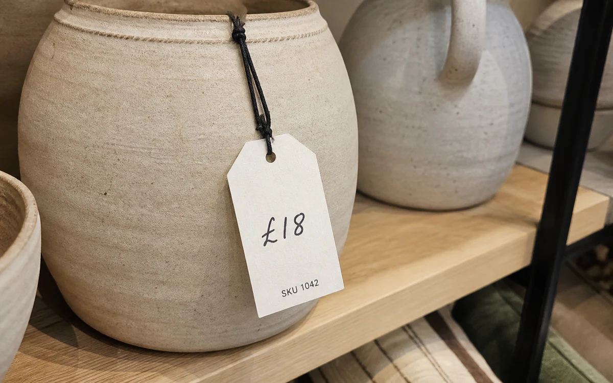 Writable uncoated price tag on a ceramic retail product
